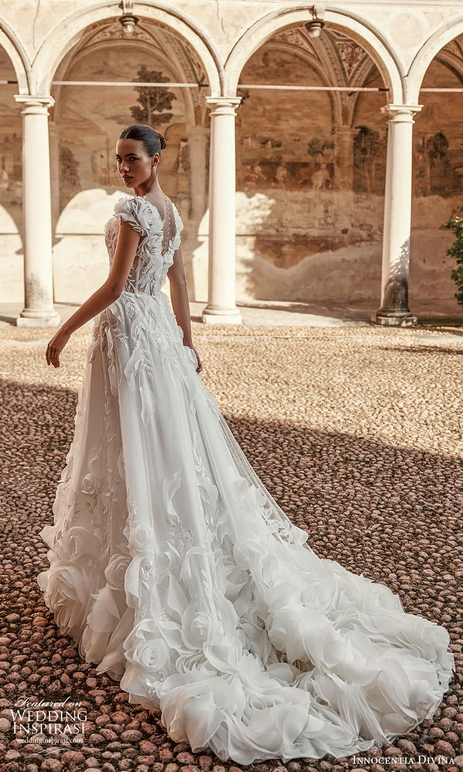 innocentia-divina-fall-2024-bridal-cap-sleeve-v-neckline-fully-embellished-a-line-ball-gown-wedding-dress-chapel-(2).jpg